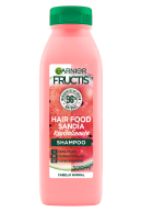 Botella de champú Garnier Fructis Hair Food con extracto de sandía, envase rojo.